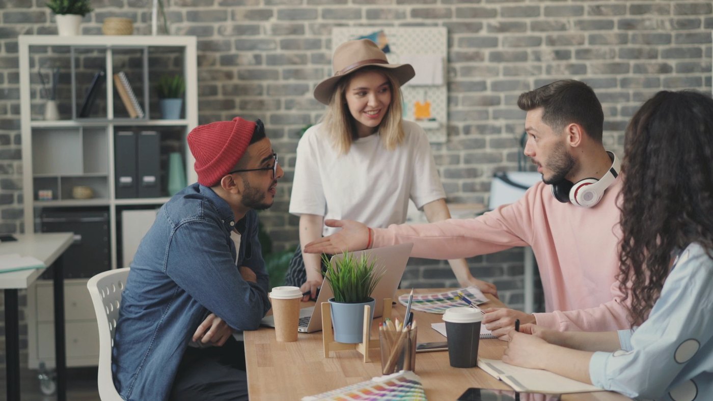 Group of young professionals brainstorming ideas in an office