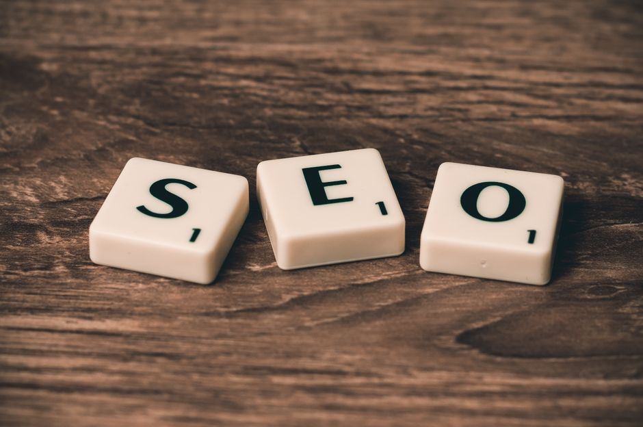 Scrabble tiles spelling SEO on a wooden table